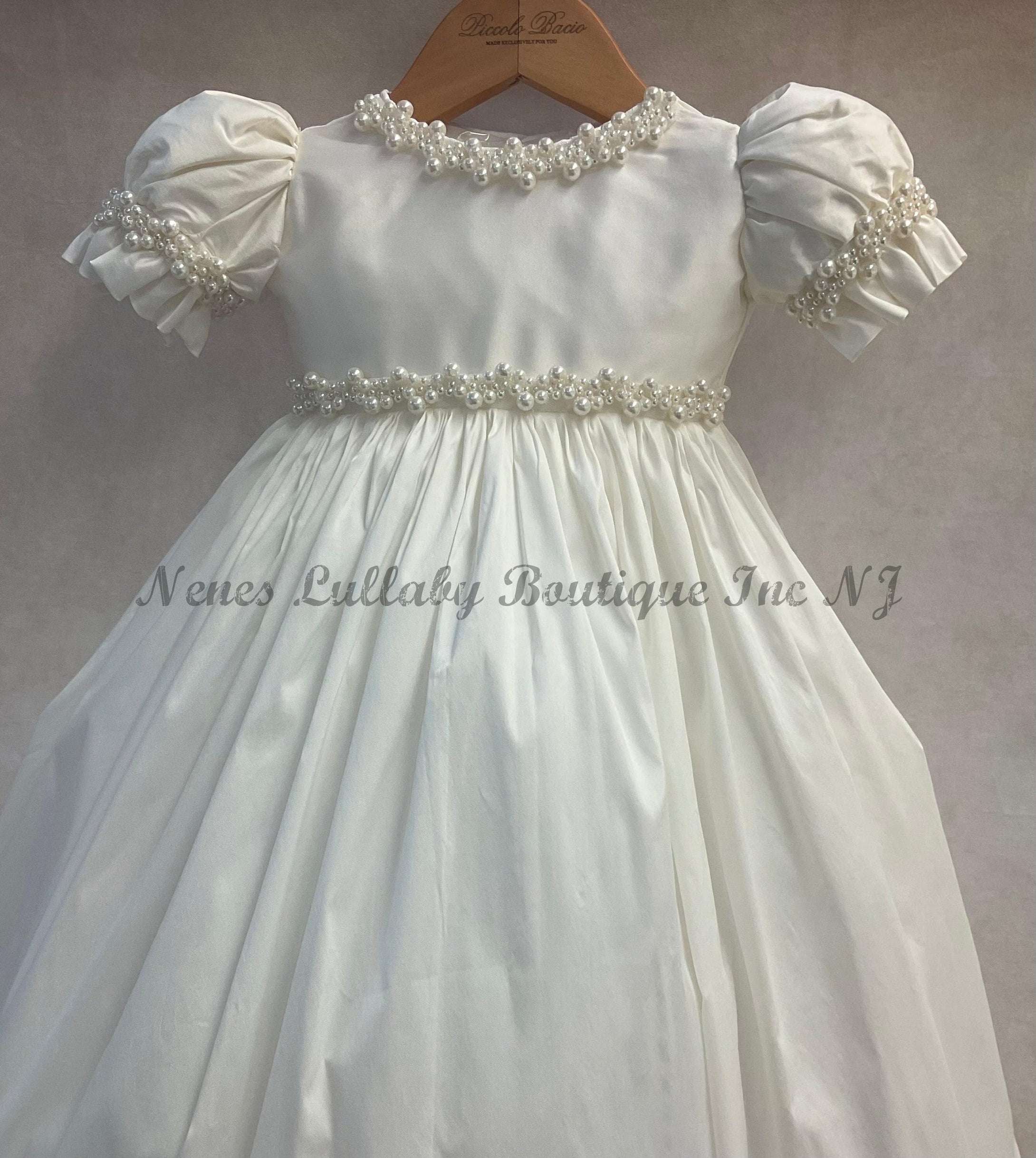 100% white silk top view of the Giovanna Baptism gown with pearl accents 